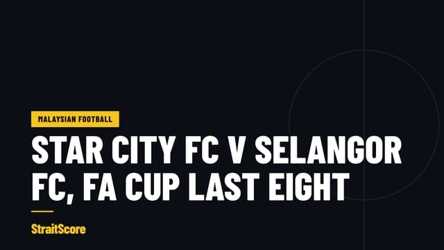 Floodlights over a packed stand at a Malaysian cup tie.